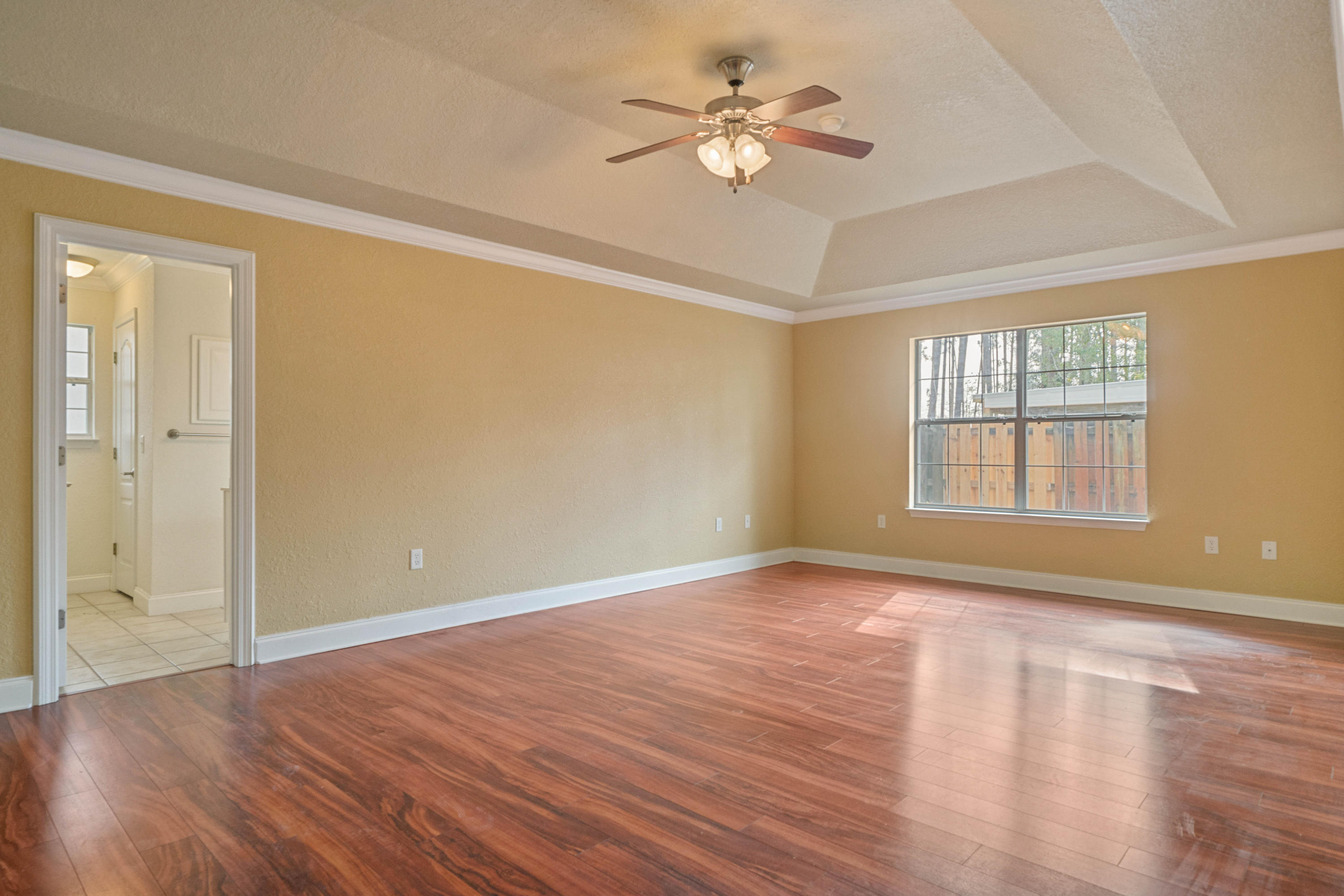 414 Driftwood Point Road Santa Rosa Beach, FL 32459 - Photo 18 of 36 a view of an empty room with a window and wooden floor