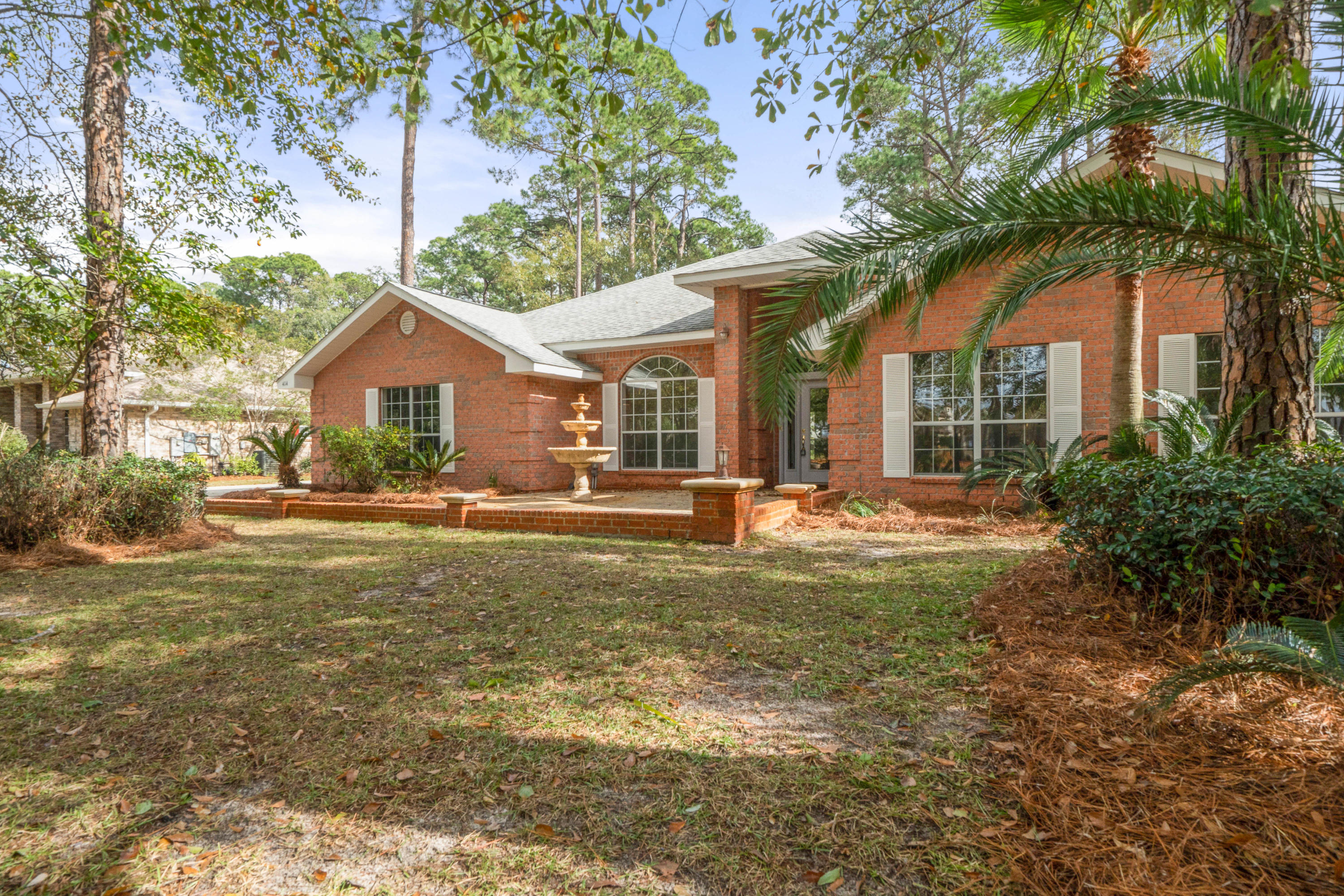414 Driftwood Point Road Santa Rosa Beach, FL 32459 - Photo 2 of 36 a view of house with a big yard and large trees