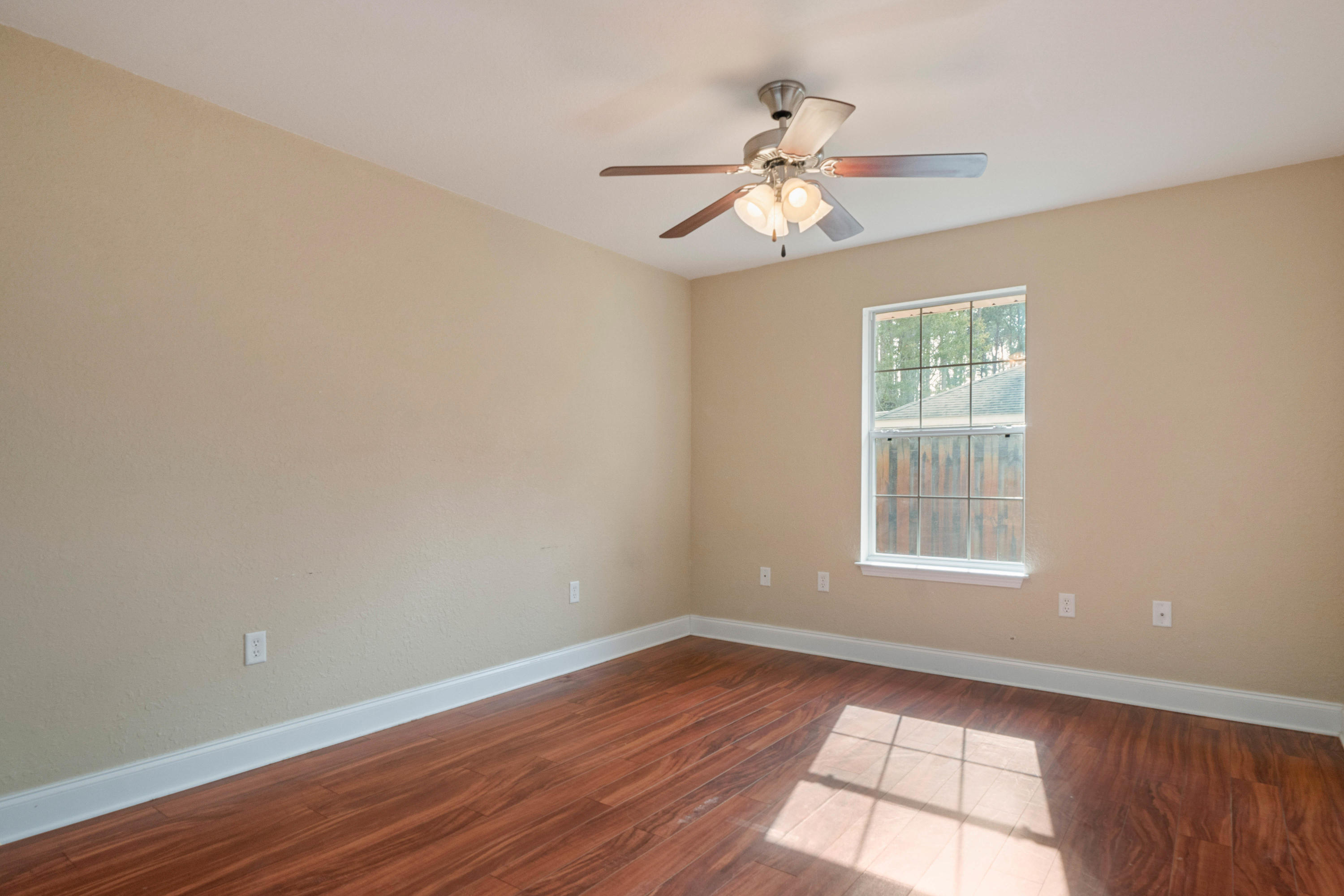 414 Driftwood Point Road Santa Rosa Beach, FL 32459 - Photo 27 of 36 wooden floor in an empty room with a window