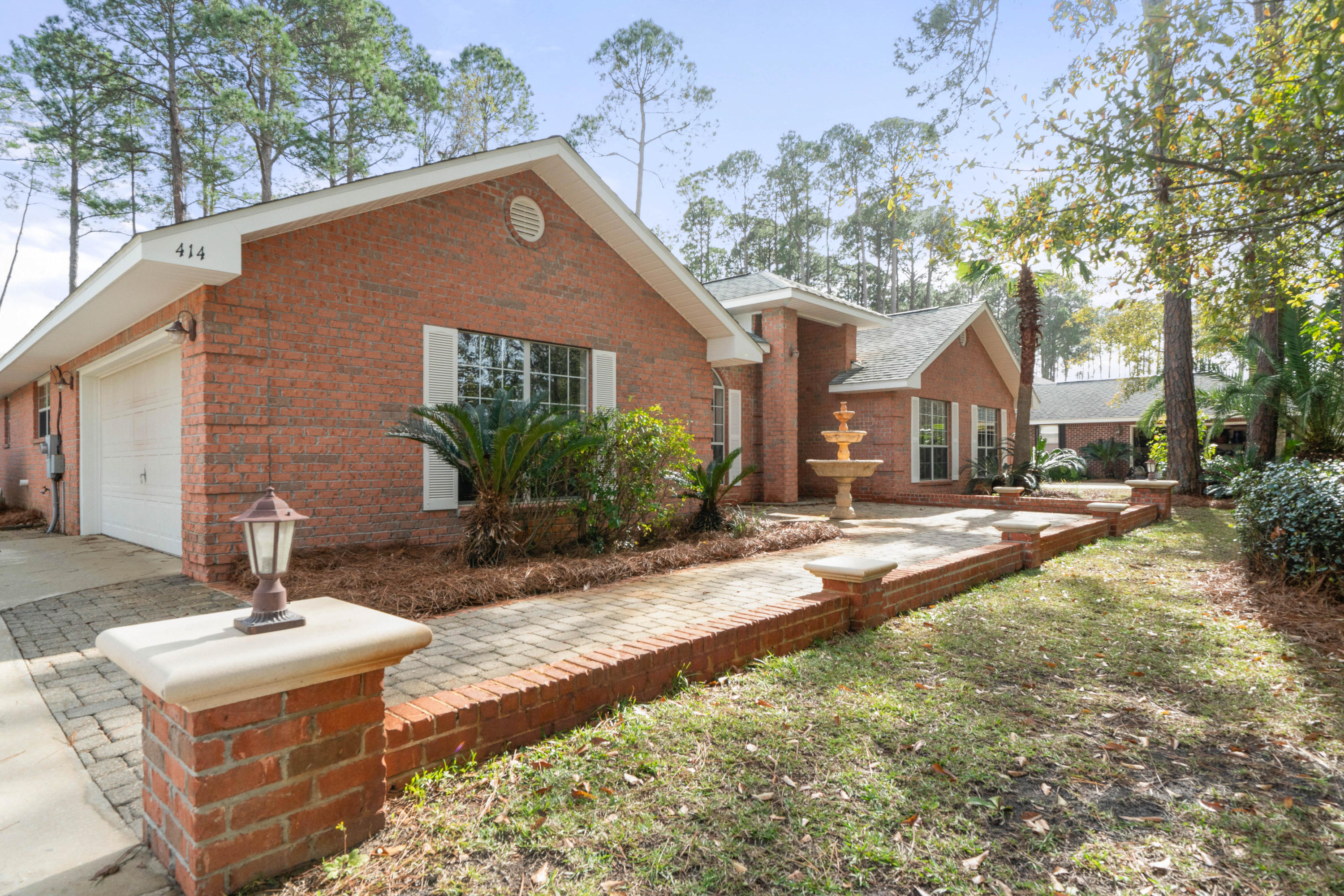 414 Driftwood Point Road Santa Rosa Beach, FL 32459 - Photo 3 of 36 a front view of a house with garden