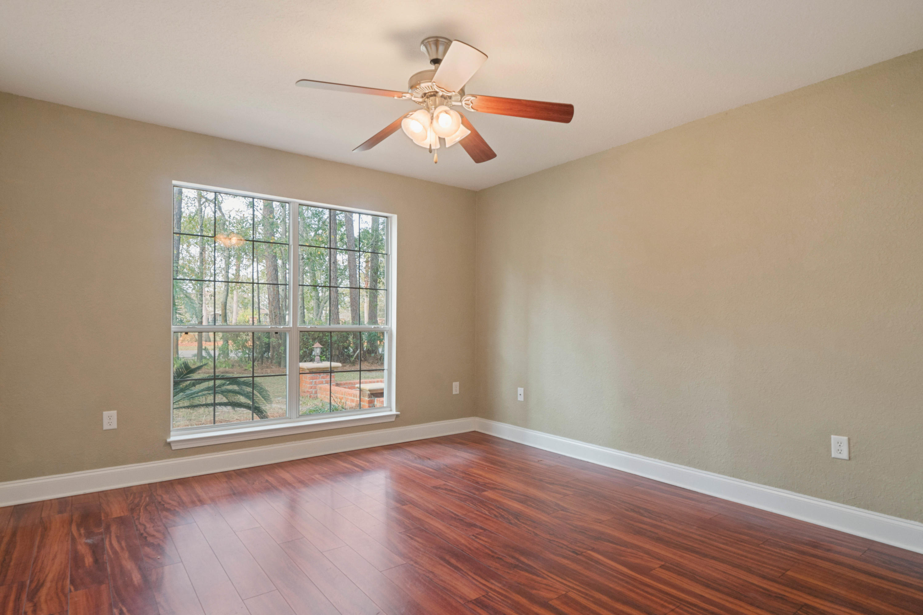 414 Driftwood Point Road Santa Rosa Beach, FL 32459 - Photo 31 of 36 a view of an empty room with wooden floor and a window