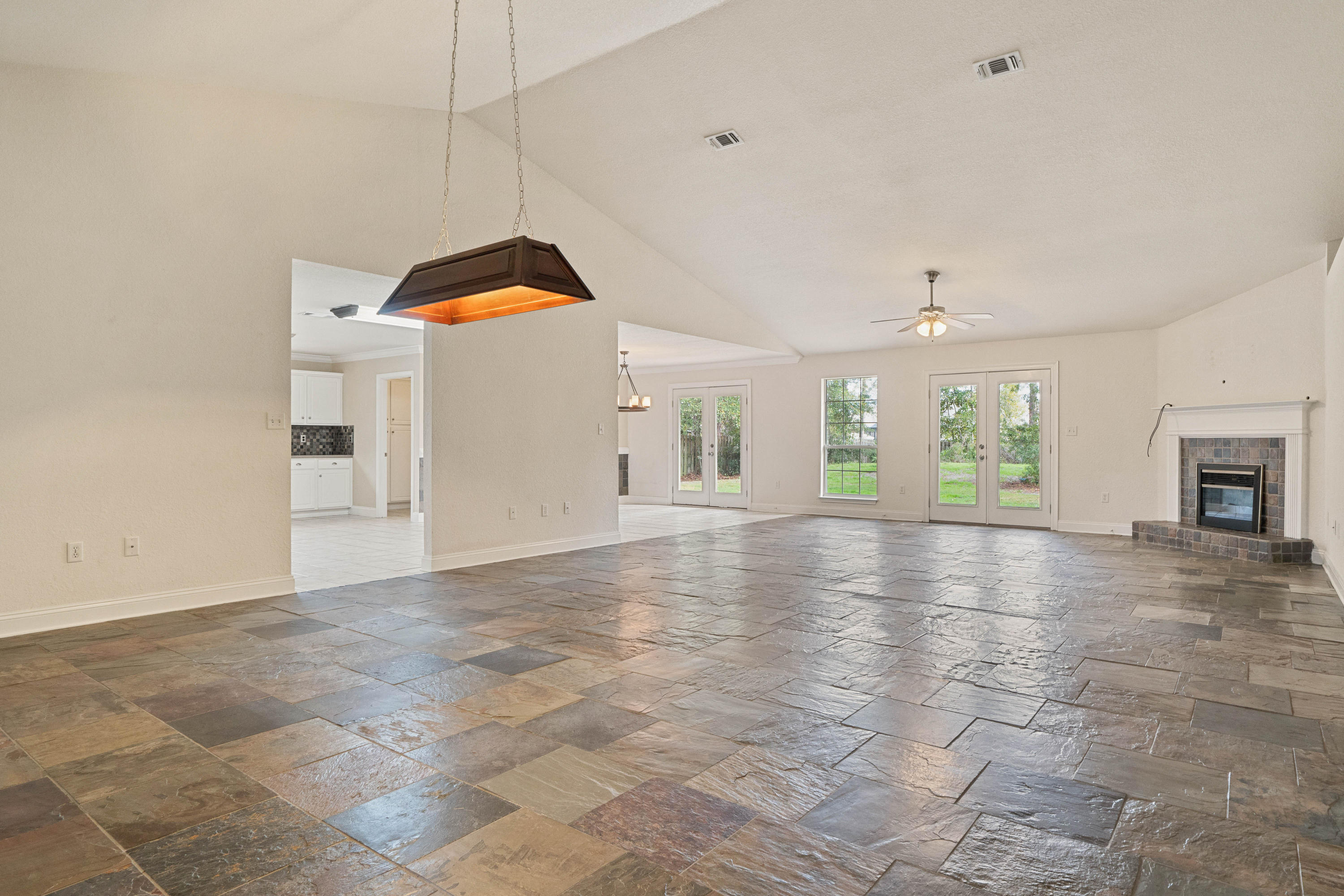 414 Driftwood Point Road Santa Rosa Beach, FL 32459 - Photo 8 of 36 a view of a kitchen with a sink and a fireplace