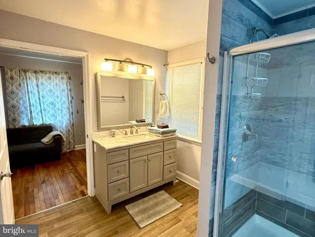 a view of bathroom with a tub shower and sink