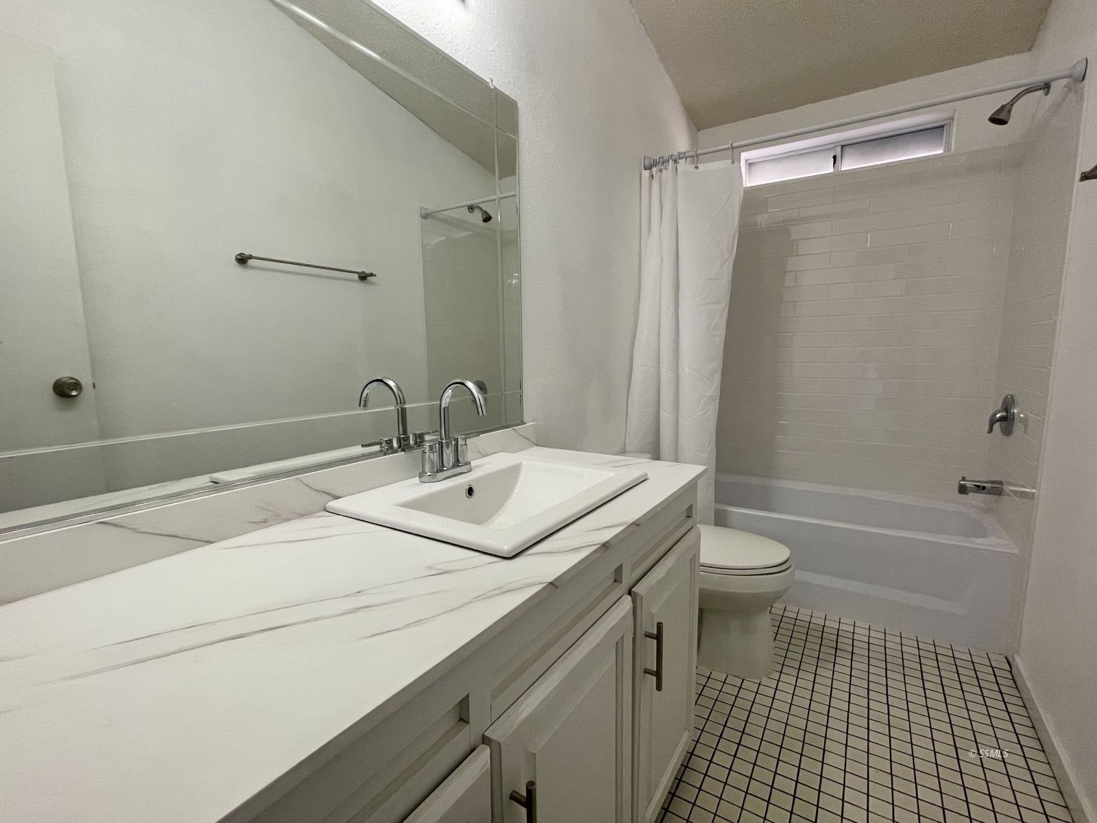 1449 Dunes Street Ridgecrest, CA 93555 - Photo 32 of 50 a bathroom with a sink a toilet a shower and a mirror