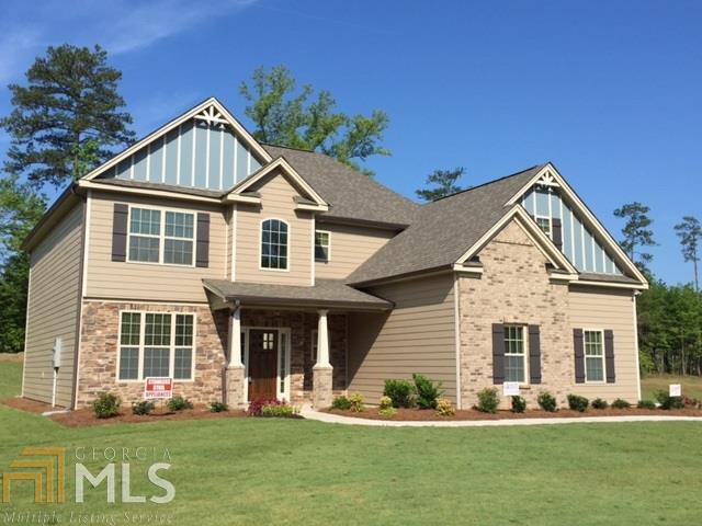 157 Caraway Road, Unit 33 Locust Grove, GA 30248 - Photo 1 of 1 a front view of a house with a yard