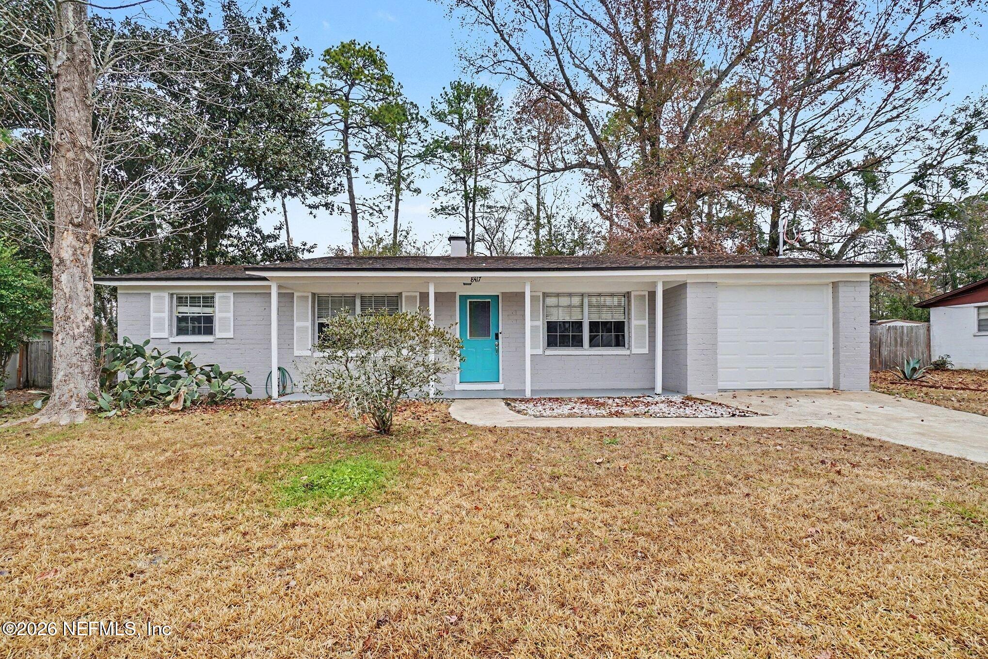 8417 Barracuda Road Jacksonville, FL 32244 - Photo 1 of 15 front view of a house with a yard