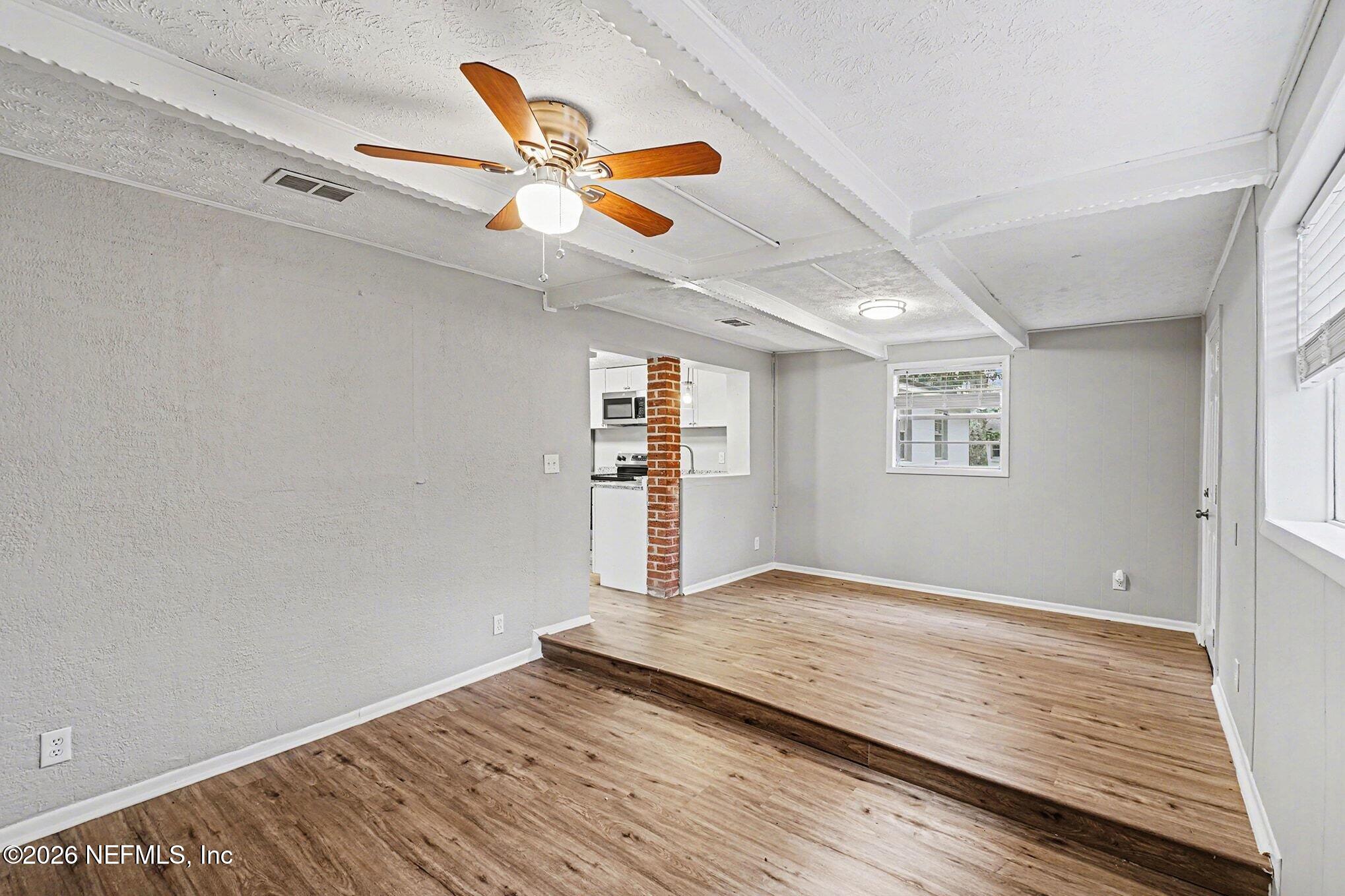 8417 Barracuda Road Jacksonville, FL 32244 - Photo 5 of 15 a view of empty room with wooden floor