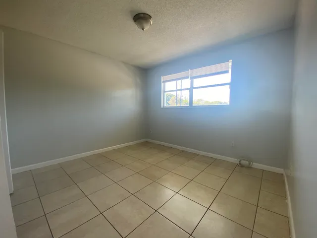 an empty room with a bathroom
