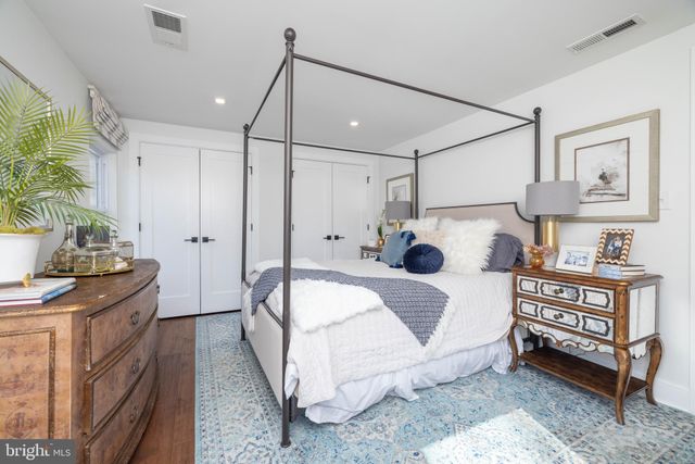 a kitchen with stainless steel appliances granite countertop a sink and a stove
