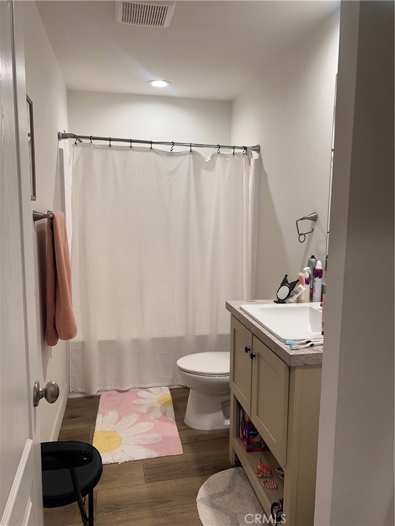 3444 West Center Street, Unit 43 Riverside, CA 92501 - Photo 11 of 16 a bathroom with a sink toilet and shower