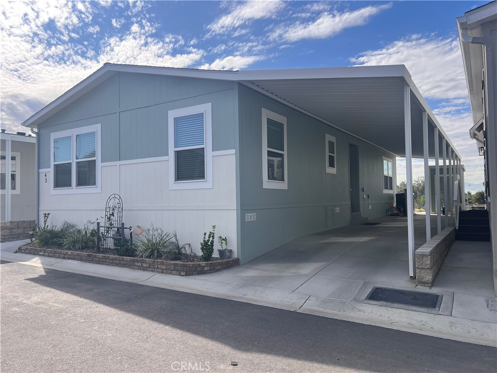 3444 West Center Street, Unit 43 Riverside, CA 92501 - Photo 3 of 16 a view of a house with a street