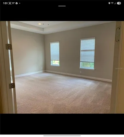 a view of empty room with windows
