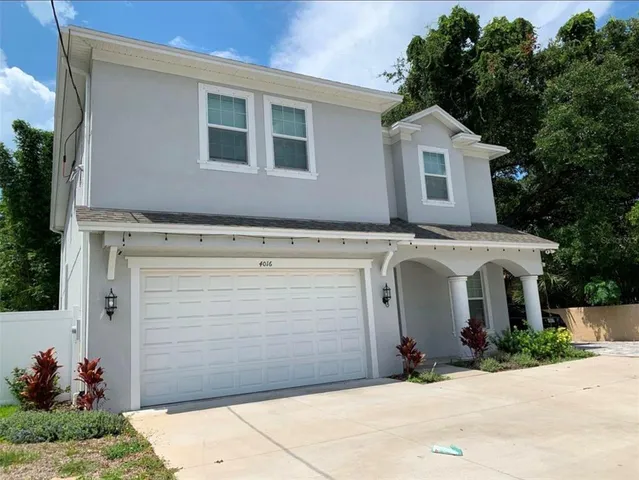a view of a house with garage