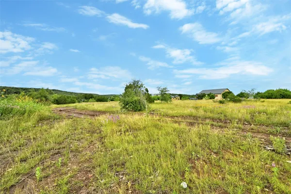 a view of a lake with a big yard