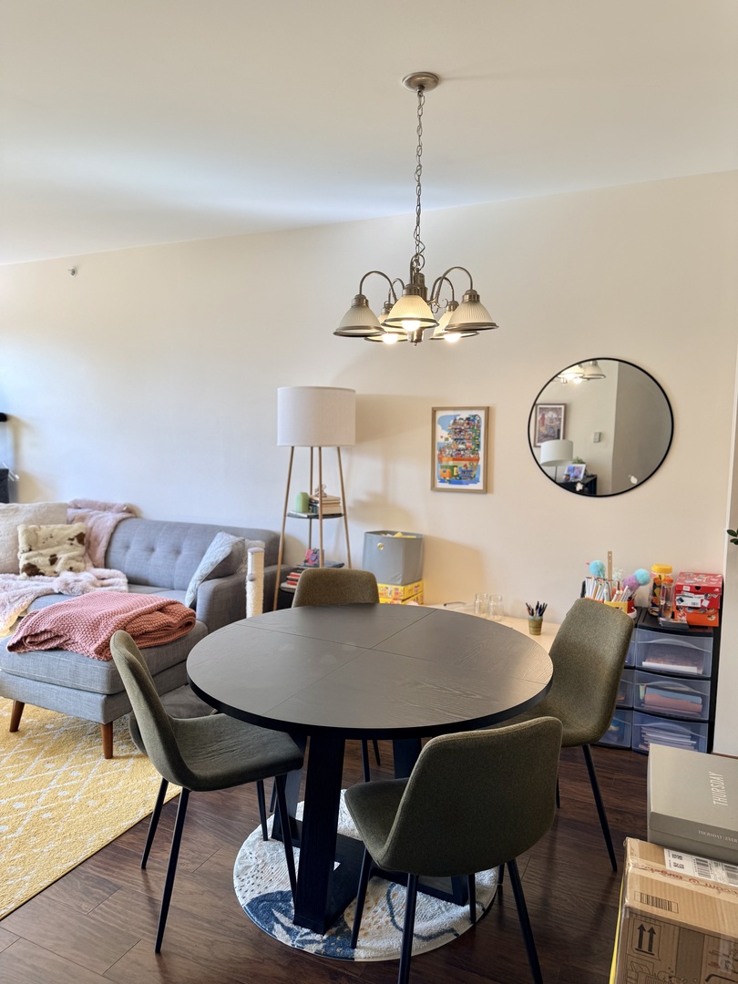 1159 East Addison Avenue Lombard, IL 60148 - Photo 7 of 14 a view of a dining room with furniture and chandelier