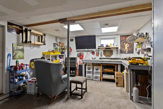 a room with furniture and a flat screen tv