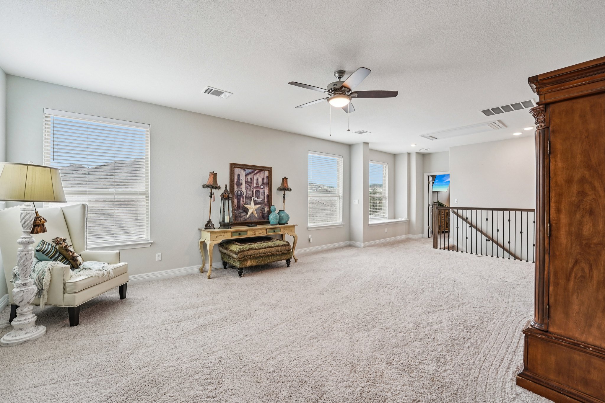 17820 Limestone Spring Lane Austin, TX 78738 - Photo 17 of 35 a living room with furniture and a chandelier