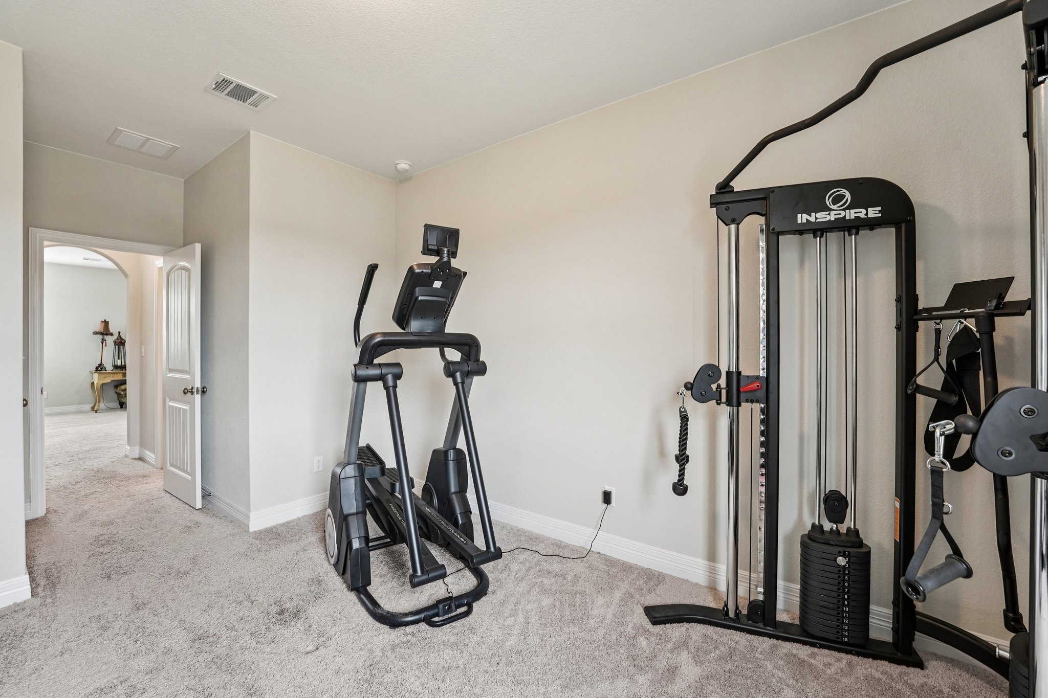 17820 Limestone Spring Lane Austin, TX 78738 - Photo 19 of 35 a view of a room with gym equipment