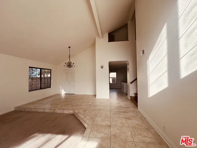 a view of a hallway with a livingroom