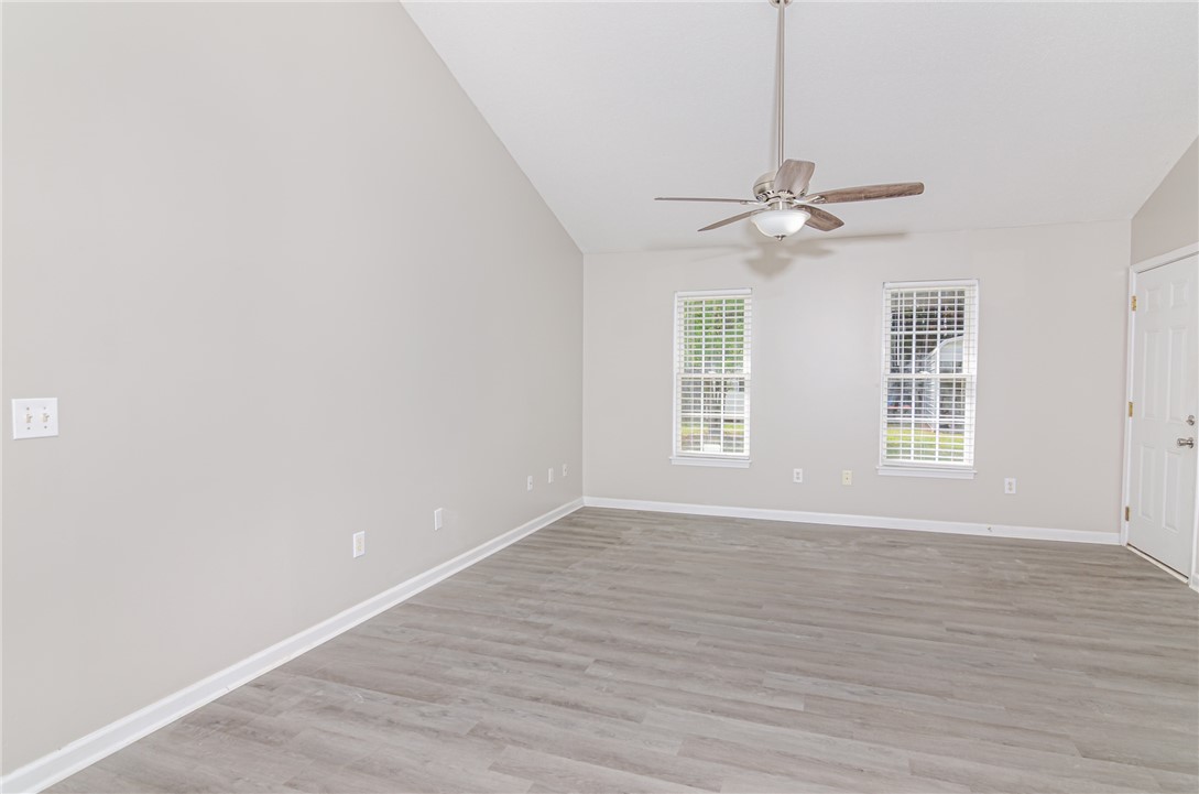 102 Hawk Ridge Drive Anderson, SC 29621 - Photo 3 of 38 Bright and airy room with vaulted ceilings and beautiful flooring, offering an inviting atmosphere.