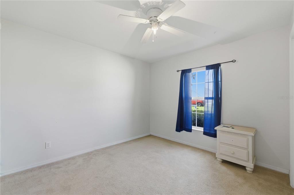 3959 Southwest 129th Street Ocala, FL 34473 - Photo 12 of 27 an empty room with windows and cabinet