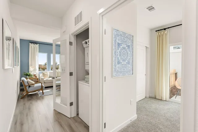 a view of a livingroom with furniture and wooden floor