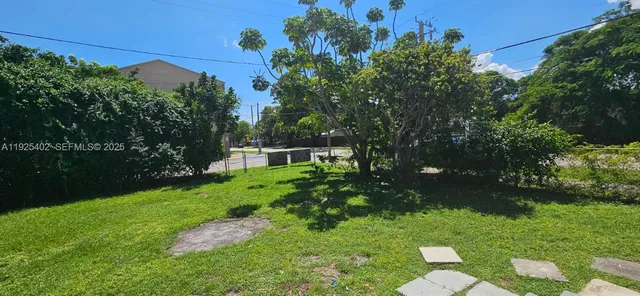 a backyard of a house with lots of green space