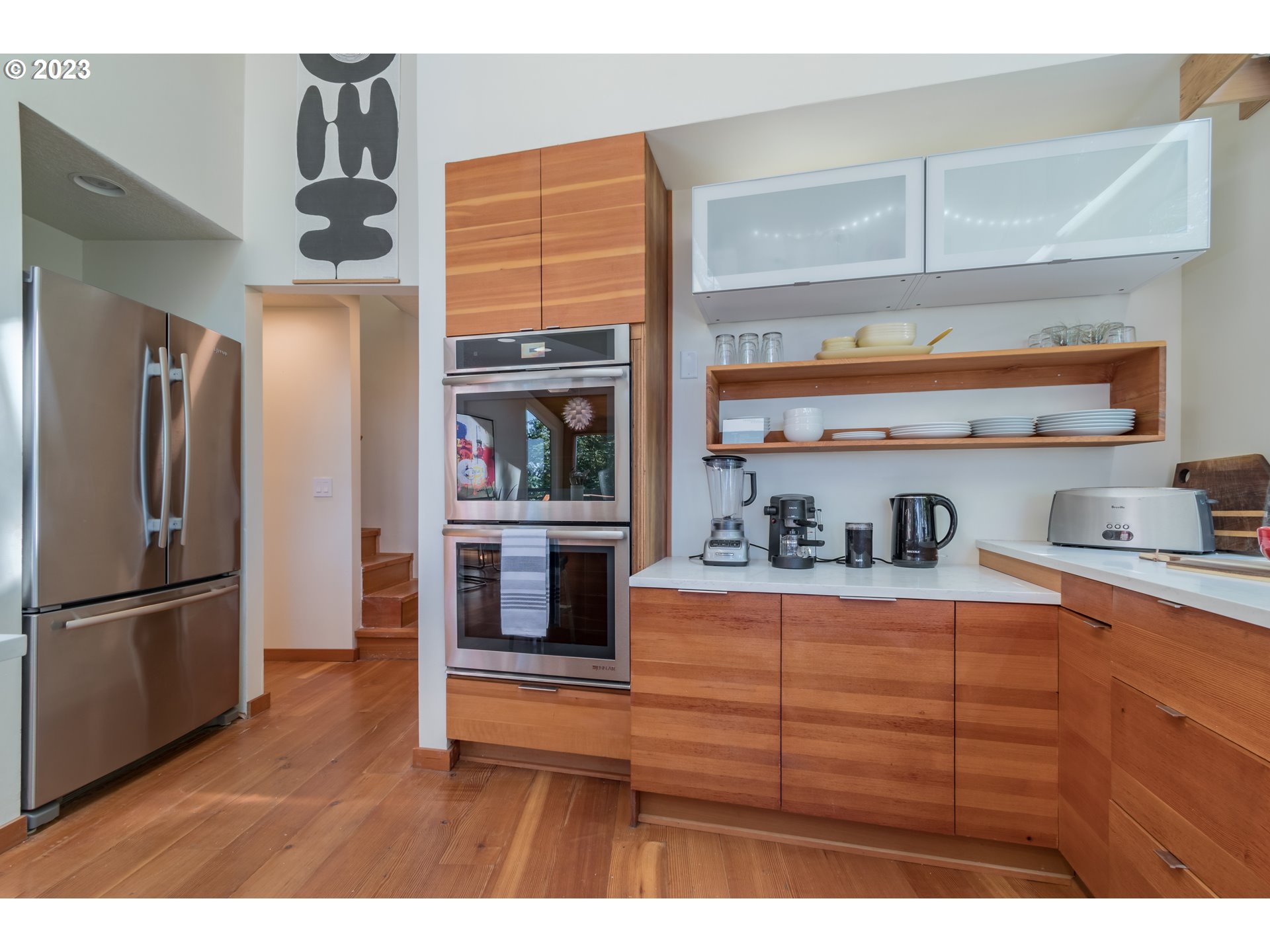 2780 Cresta De Ruta Street Eugene, OR 97403 - Photo 14 of 48 a kitchen with stainless steel appliances kitchen island granite countertop a refrigerator and cabinets