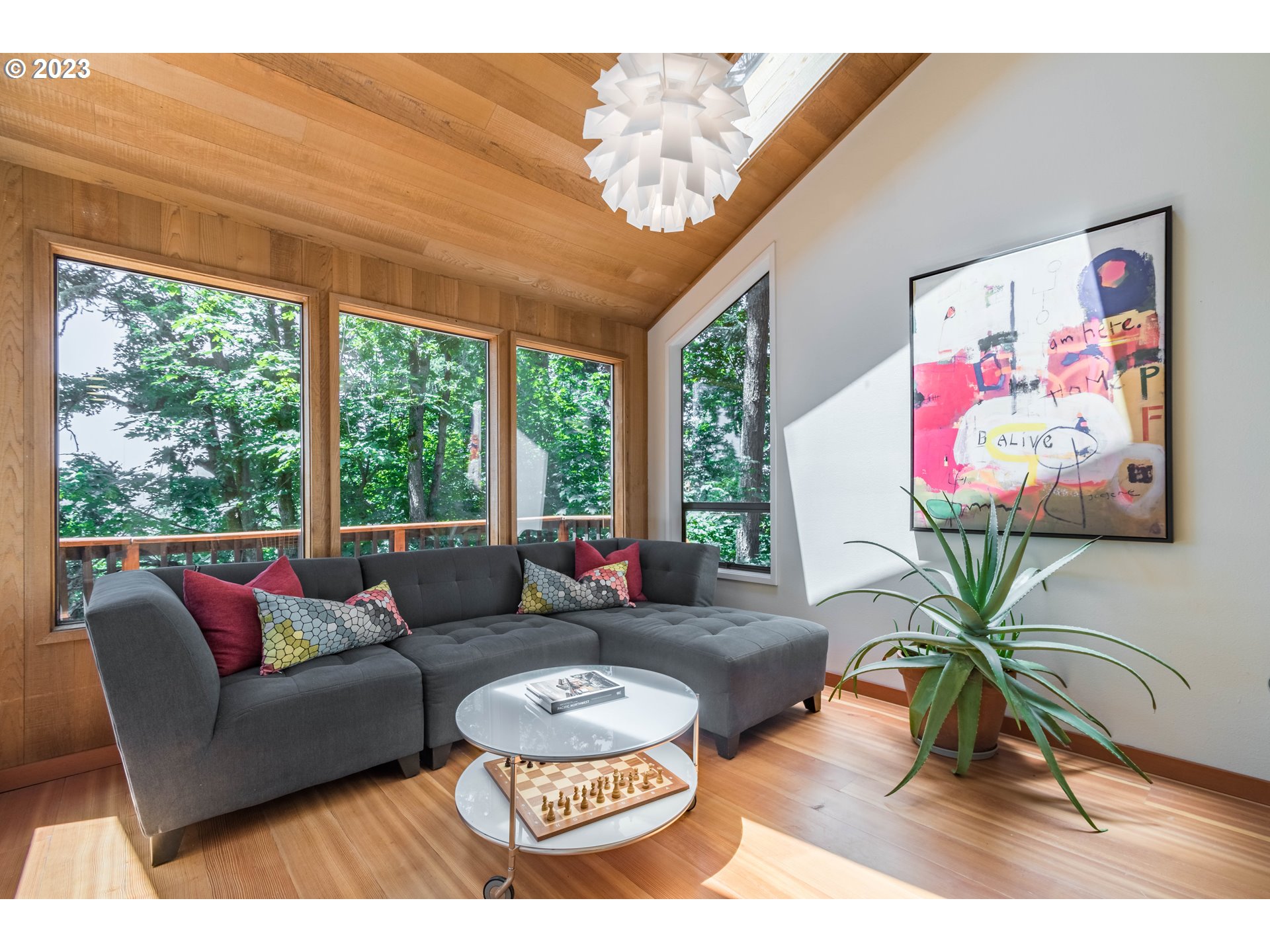 2780 Cresta De Ruta Street Eugene, OR 97403 - Photo 16 of 48 a living room with furniture a flat screen tv and a large window