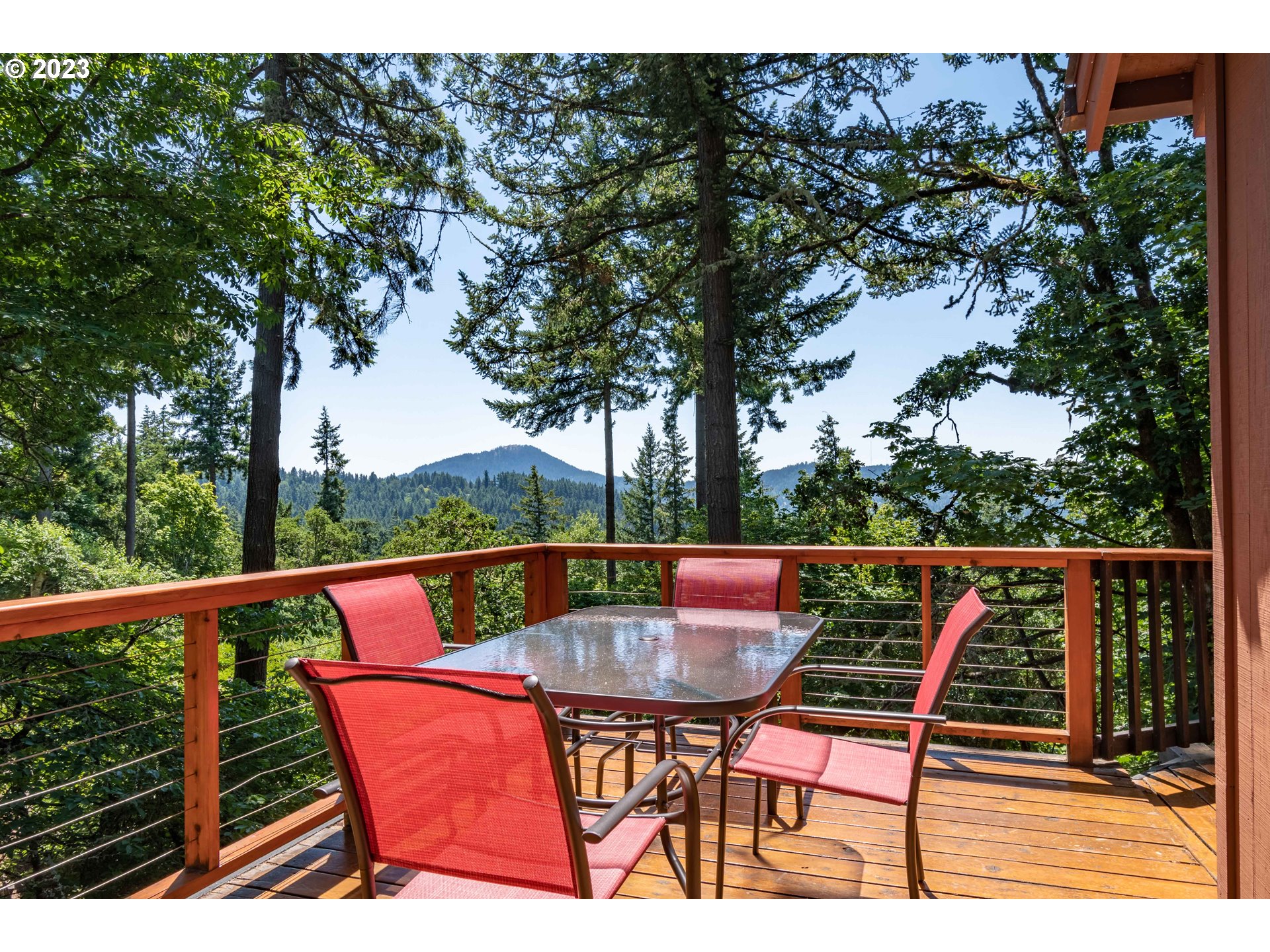 2780 Cresta De Ruta Street Eugene, OR 97403 - Photo 18 of 48 a balcony with wooden floor and outdoor seating