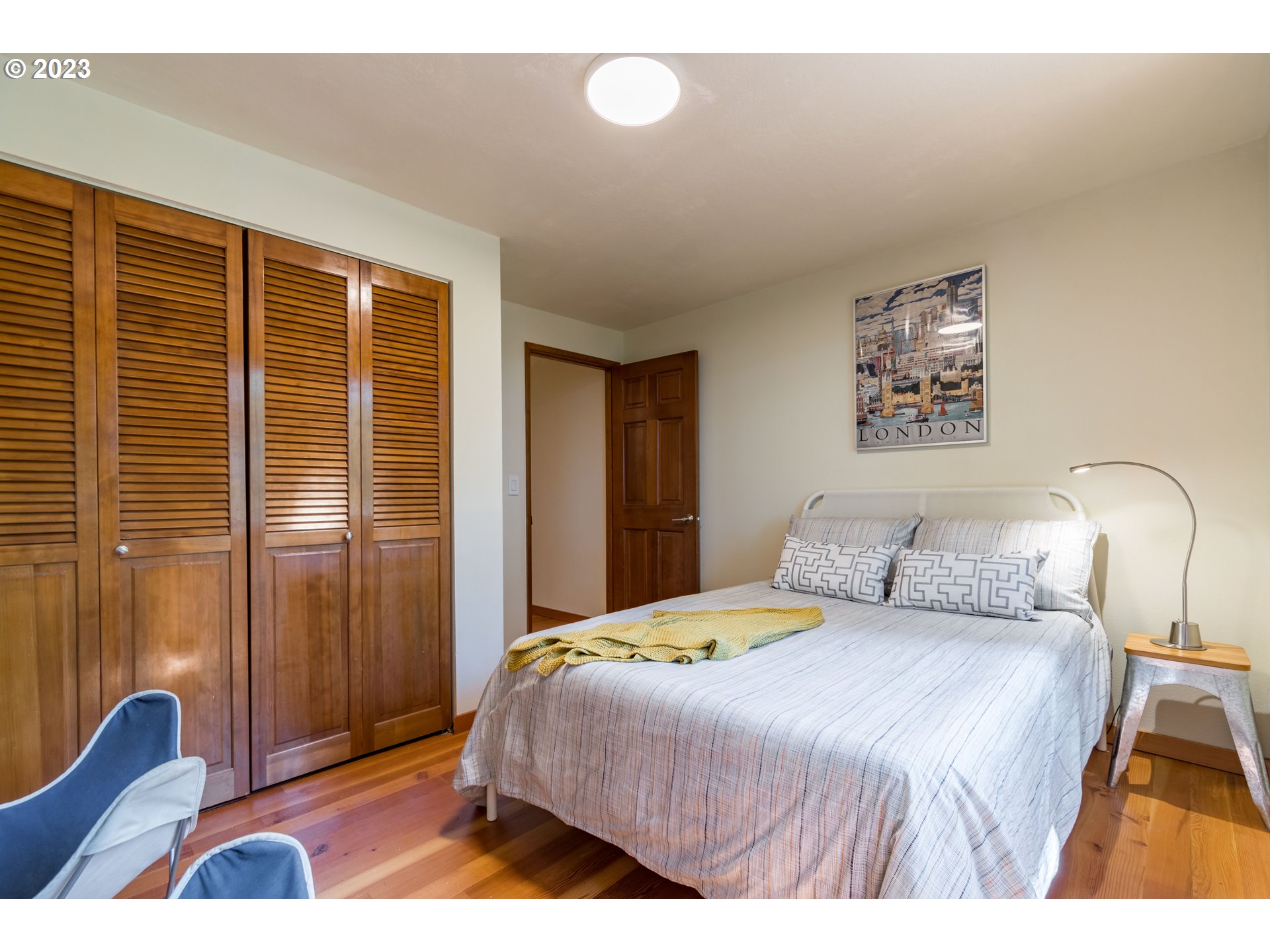 2780 Cresta De Ruta Street Eugene, OR 97403 - Photo 28 of 48 a bedroom with a bed and painting on the wall