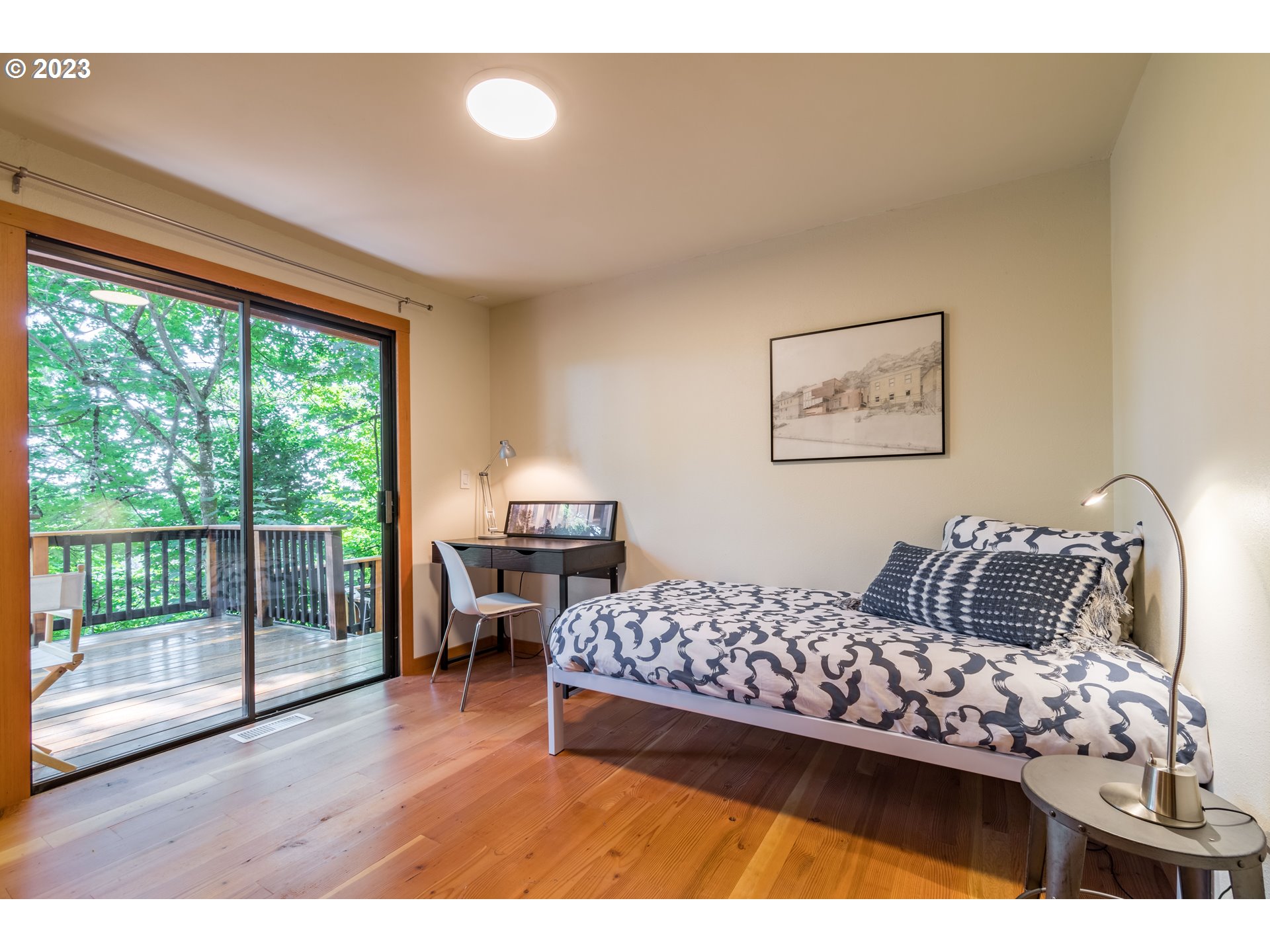 2780 Cresta De Ruta Street Eugene, OR 97403 - Photo 29 of 48 a bedroom with a bed and wooden floor