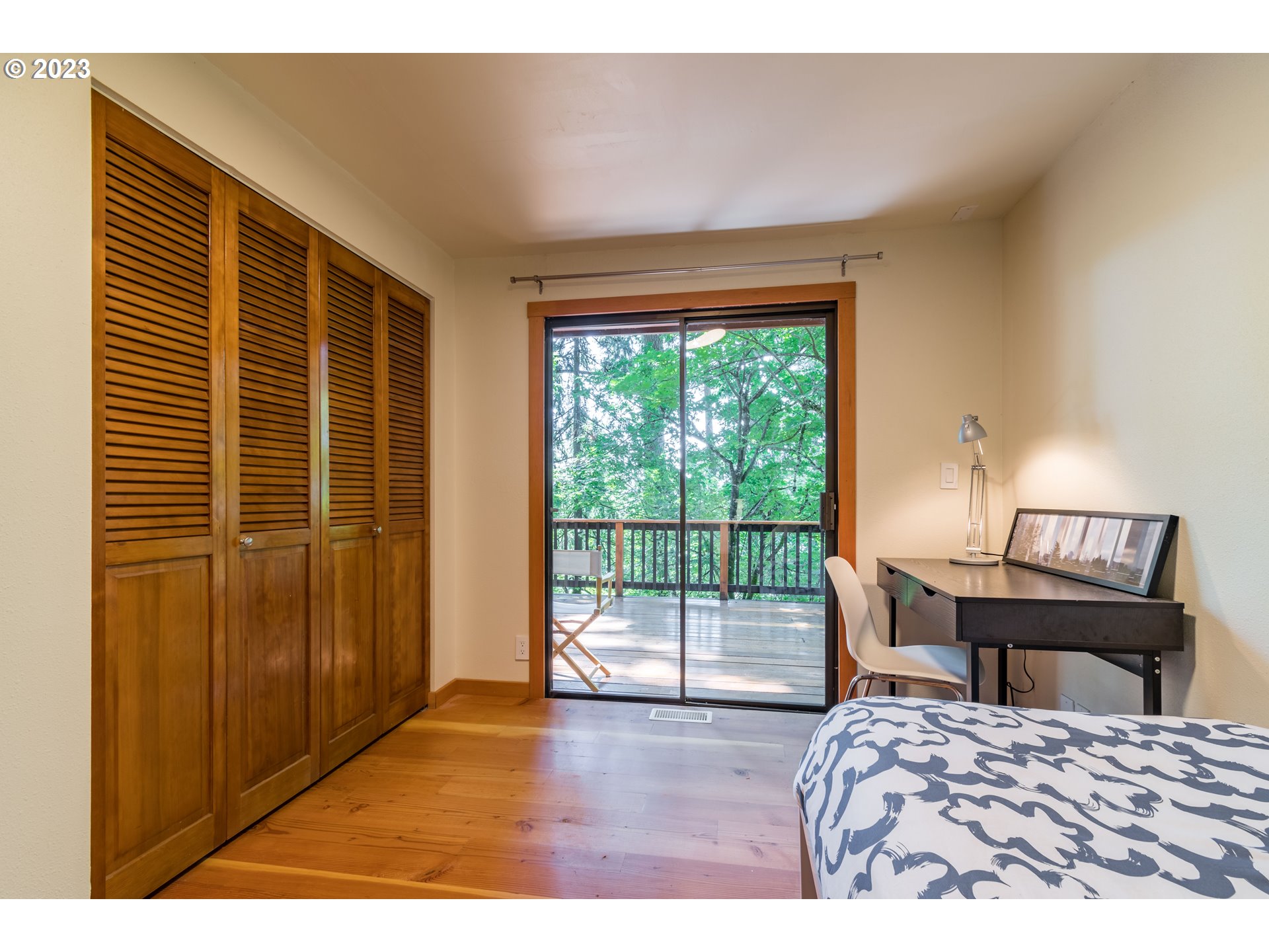 2780 Cresta De Ruta Street Eugene, OR 97403 - Photo 30 of 48 a bedroom with a bed and wooden floor