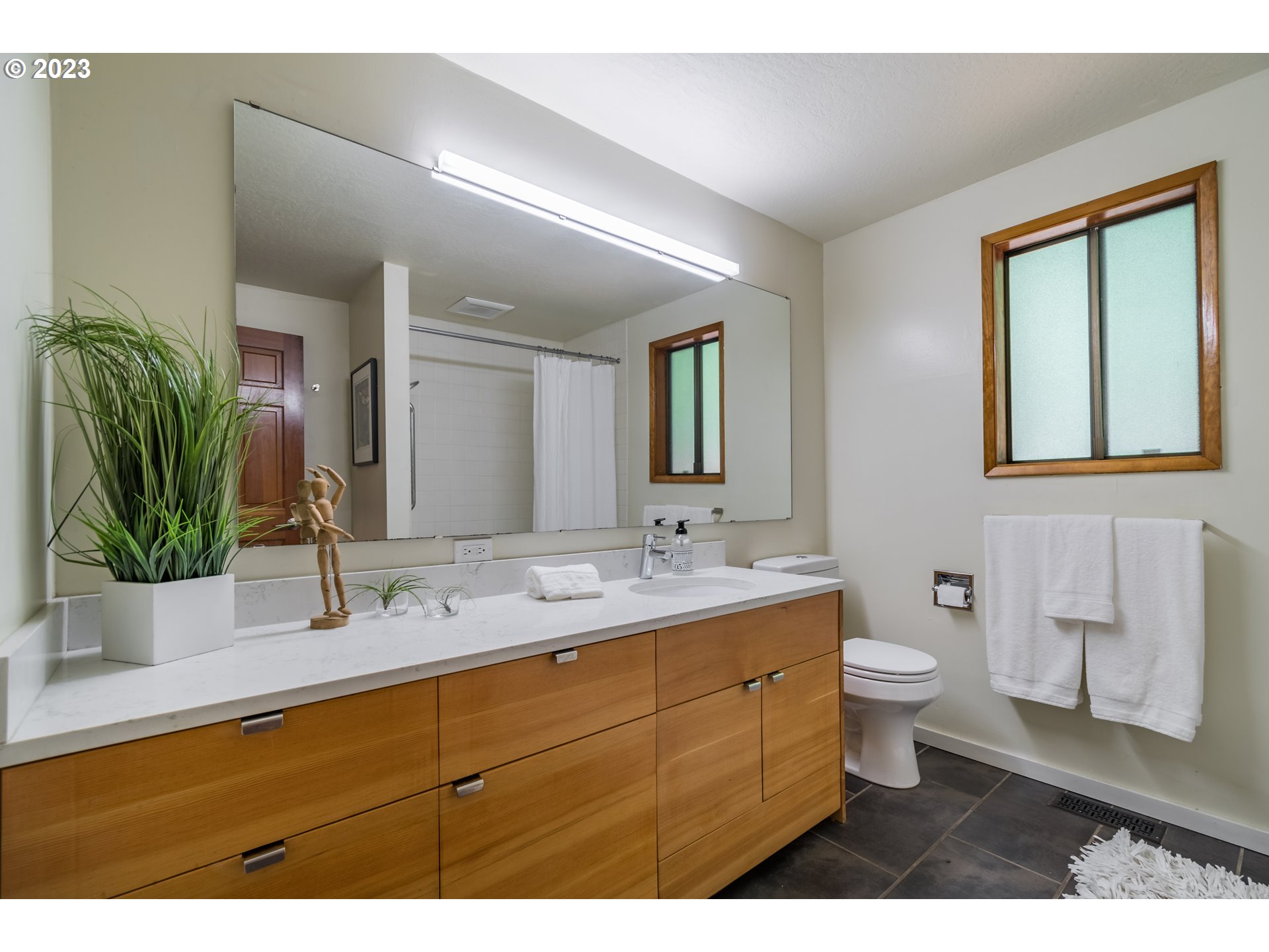 2780 Cresta De Ruta Street Eugene, OR 97403 - Photo 31 of 48 a bathroom with a double vanity sink toilet and mirror