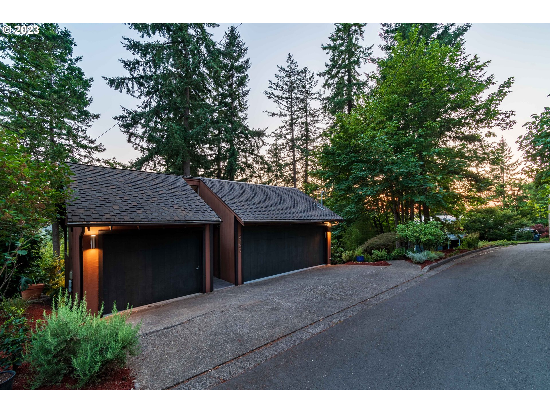 2780 Cresta De Ruta Street Eugene, OR 97403 - Photo 45 of 48 a view of a house with a tree and plants