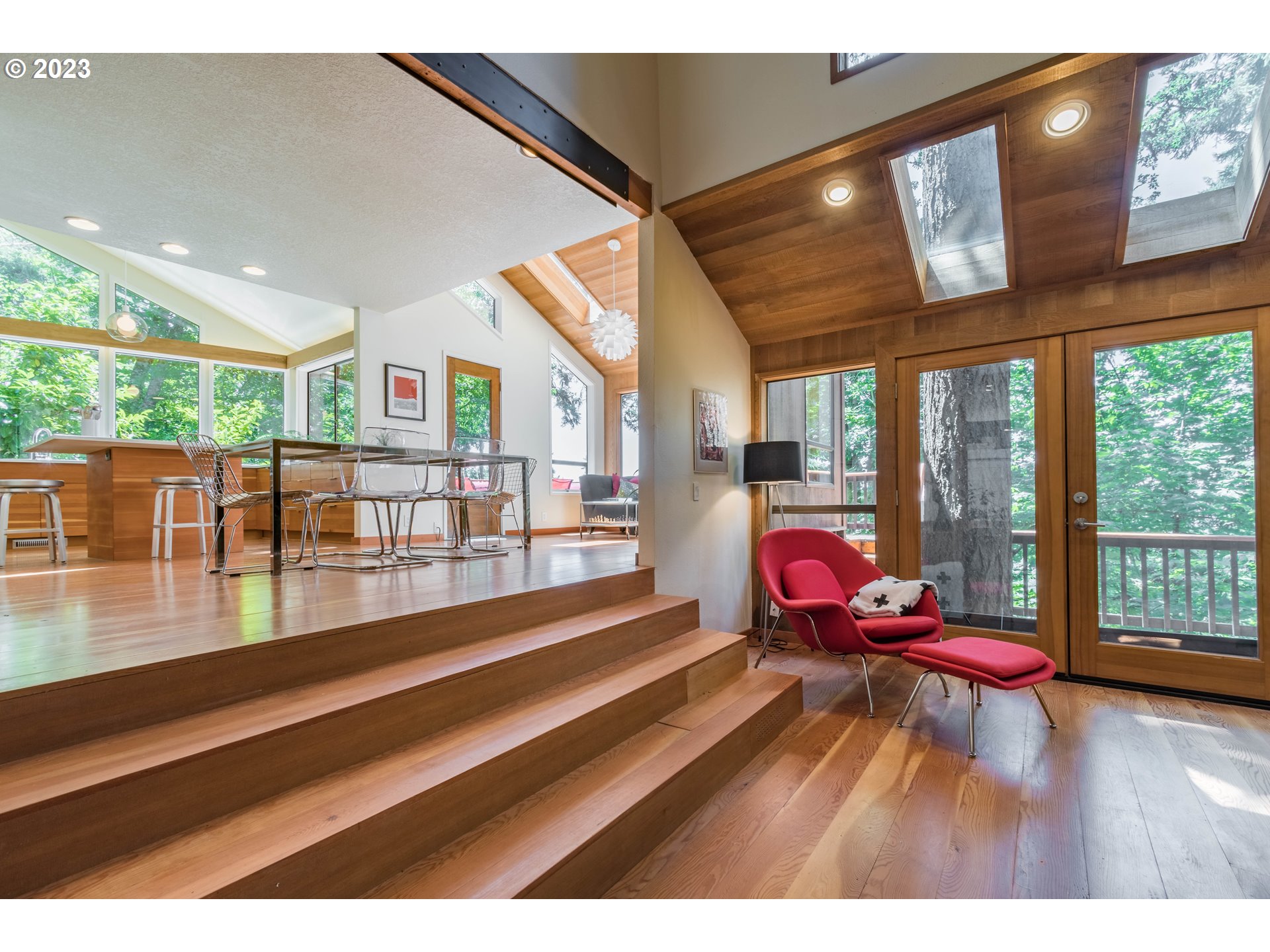 2780 Cresta De Ruta Street Eugene, OR 97403 - Photo 8 of 48 a living room with furniture floor to ceiling window and wooden floor