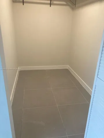 a view of a room that has a window in it