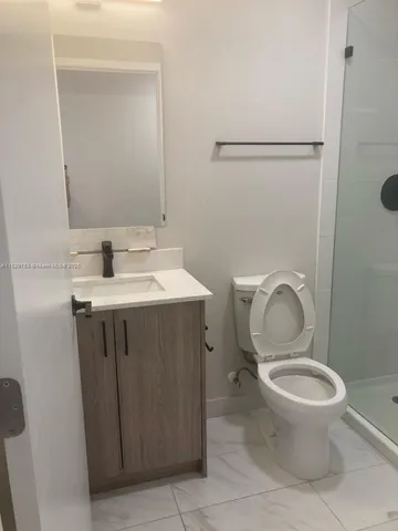 a view of a room that has a window in it