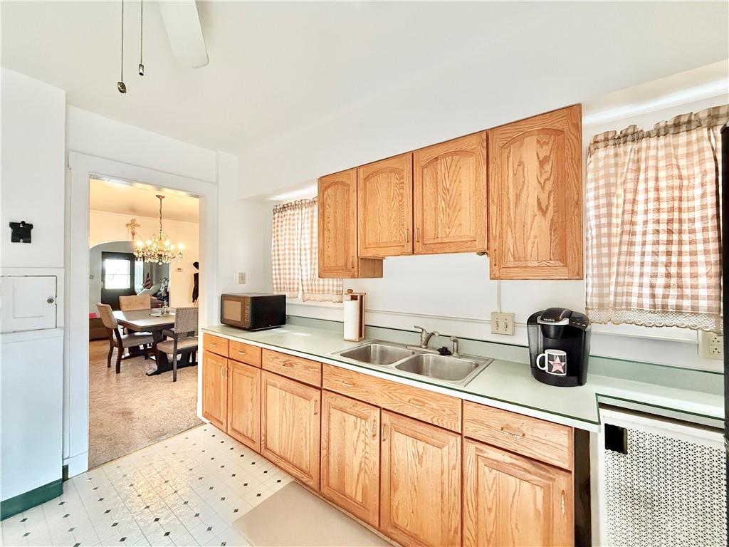 3232 California Avenue Pittsburgh, PA 15212 - Photo 12 of 38 a kitchen with stainless steel appliances a sink a counter top space and a window
