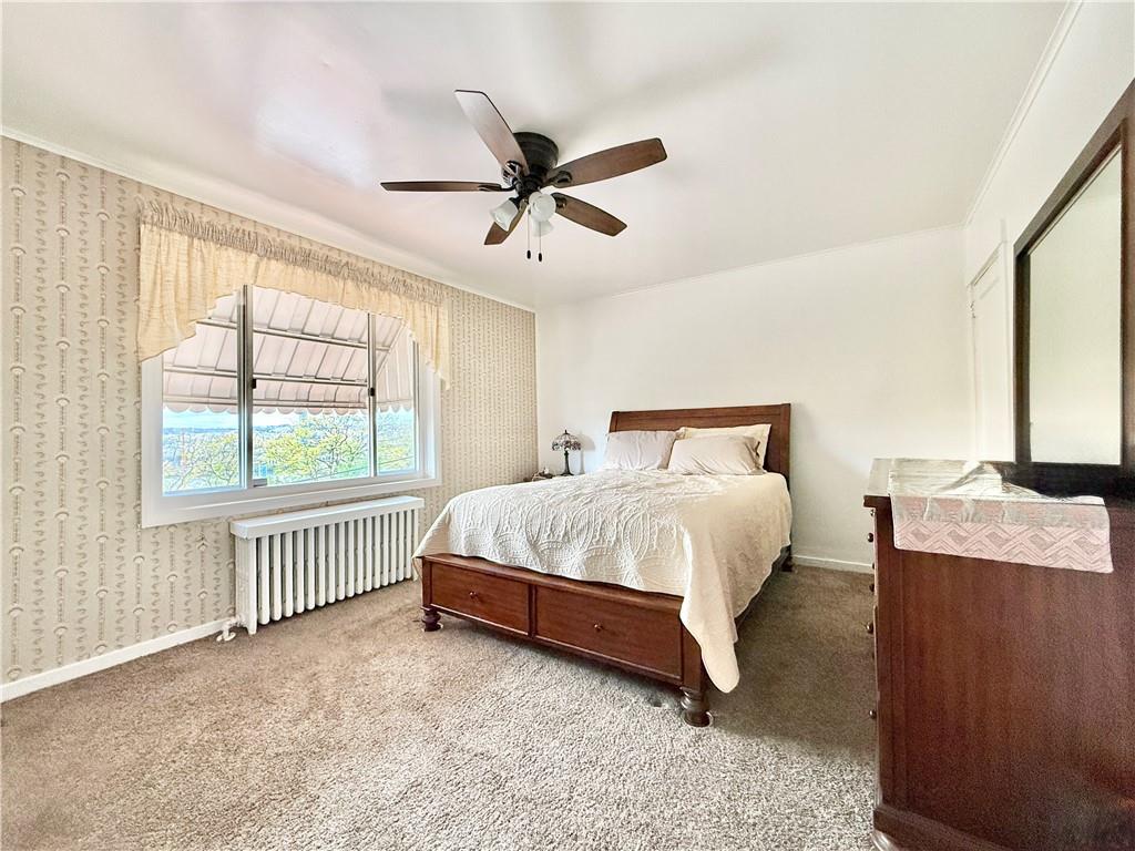 3232 California Avenue Pittsburgh, PA 15212 - Photo 19 of 38 a spacious bedroom with a bed and a window