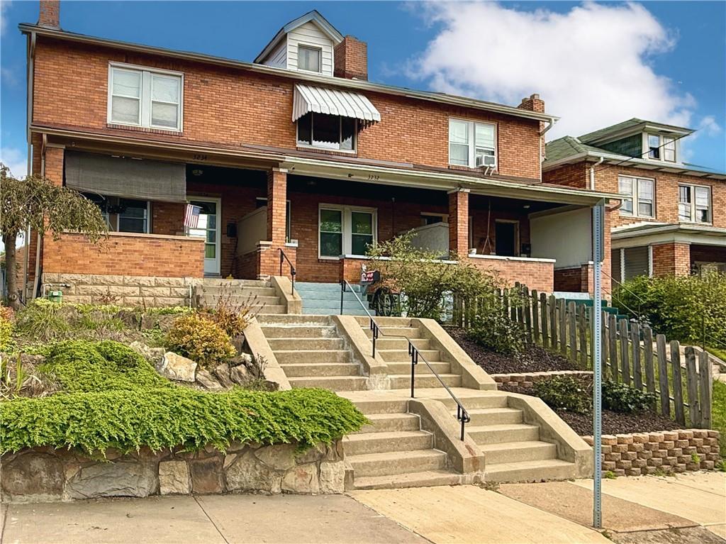 3232 California Avenue Pittsburgh, PA 15212 - Photo 2 of 38 a front view of a house with a yard