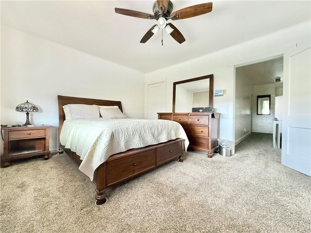 3232 California Avenue Pittsburgh, PA 15212 - Photo 21 of 38 a spacious bedroom with a bed and dresser