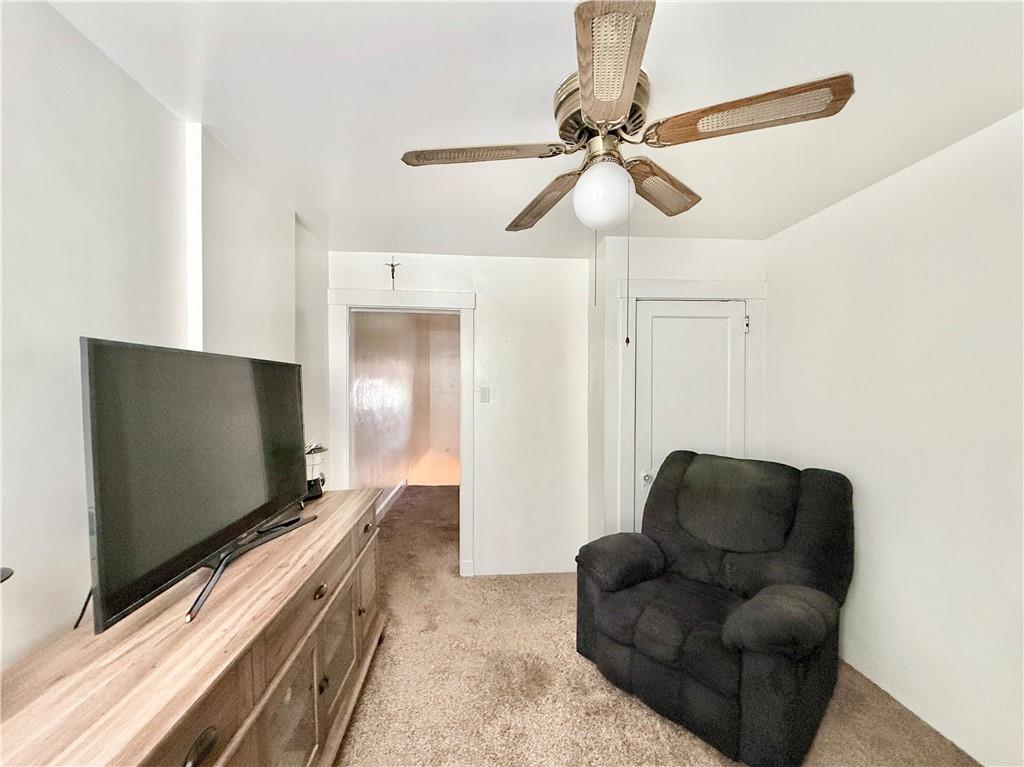 3232 California Avenue Pittsburgh, PA 15212 - Photo 25 of 38 a living room with furniture and a flat screen tv