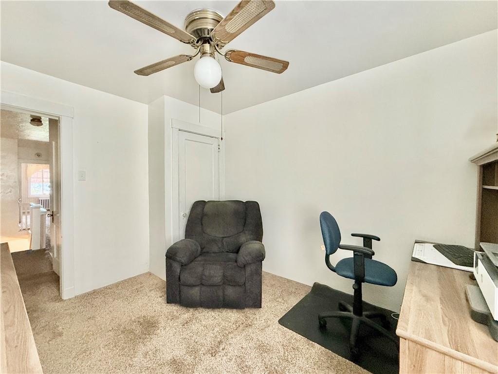 3232 California Avenue Pittsburgh, PA 15212 - Photo 26 of 38 a living room with furniture and a chandelier