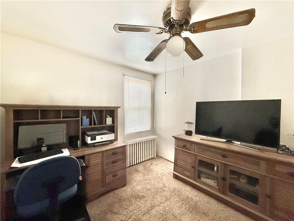 3232 California Avenue Pittsburgh, PA 15212 - Photo 27 of 38 a living room with furniture and a flat screen tv