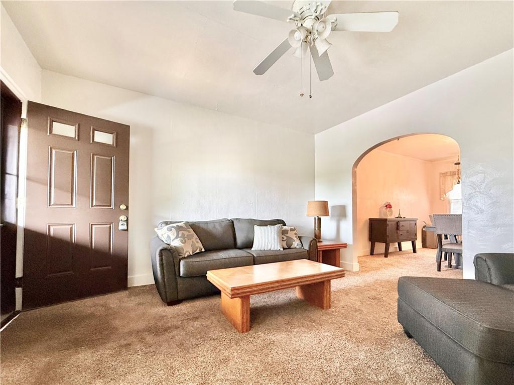 3232 California Avenue Pittsburgh, PA 15212 - Photo 6 of 38 a living room with furniture a dining table and a chandelier