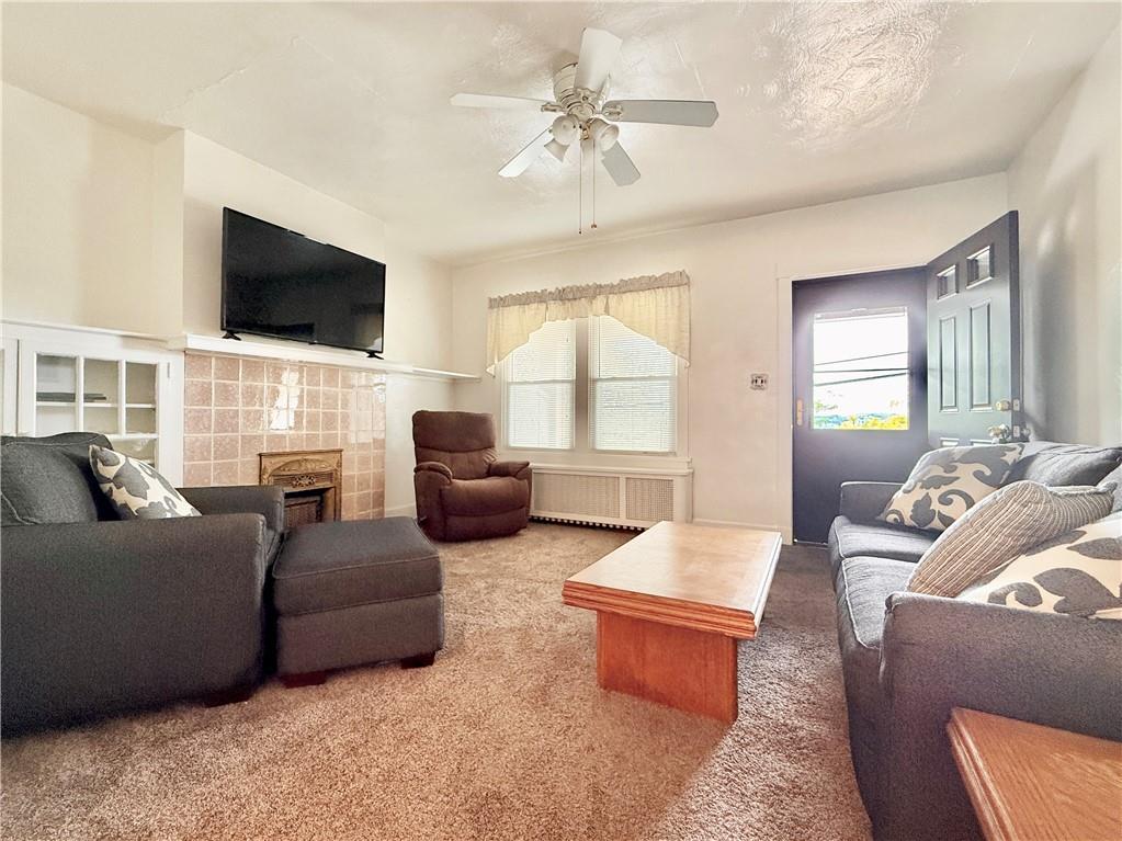 3232 California Avenue Pittsburgh, PA 15212 - Photo 7 of 38 a living room with furniture fireplace and a flat screen tv