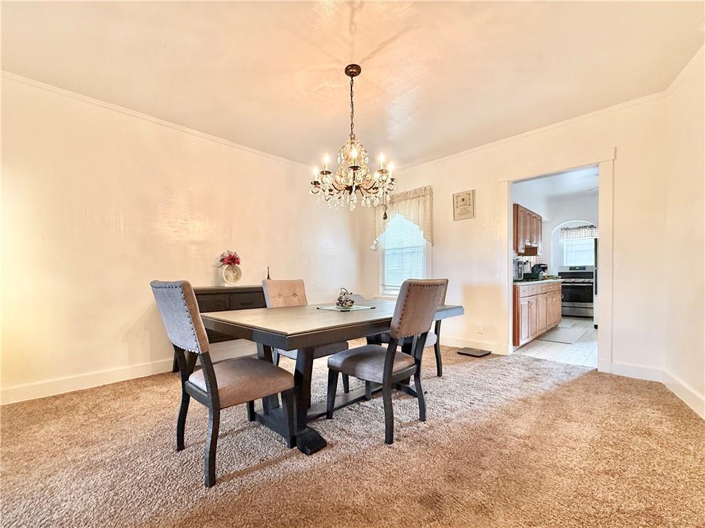 3232 California Avenue Pittsburgh, PA 15212 - Photo 9 of 38 a view of a dining room with furniture and chandelier
