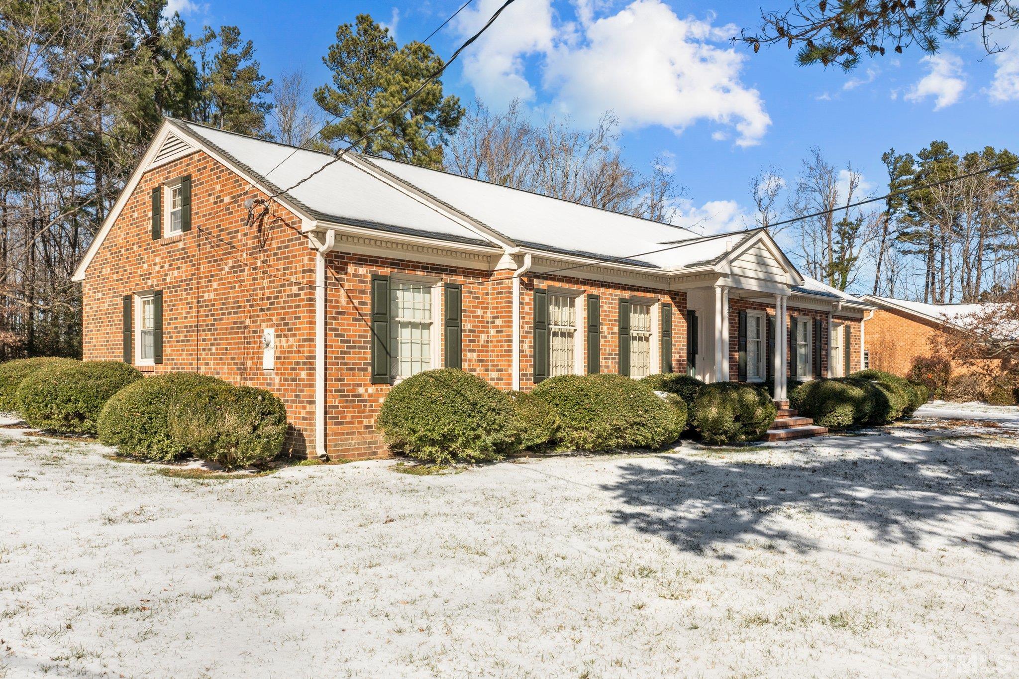 321 Ridge Road Roxboro, NC 27573 - Photo 7 of 30 a front view of a house with a yard