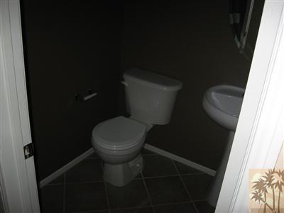 67698 Rio Arapaho Road Cathedral City, CA 92234 - Photo 4 of 11 a white toilet sitting next to a shower